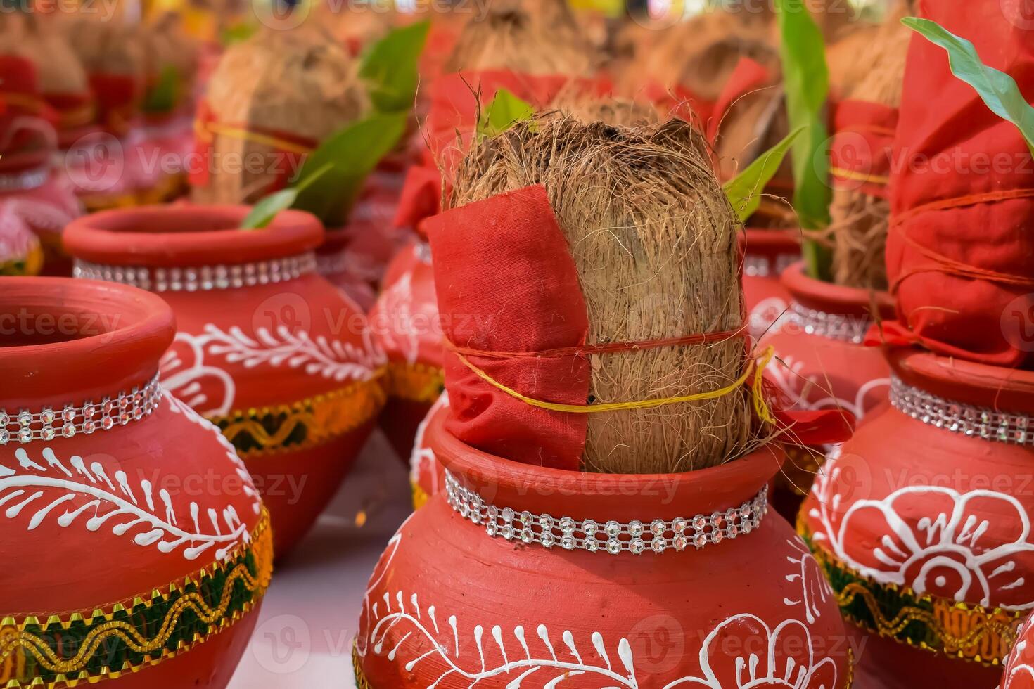 Kalash with coconut and mango leaf with floral decoration earthen pots containing sacred water. Kalash for hindu puja during Jagannath Temple Mangal Kalash Yatra, front view, closeup photo