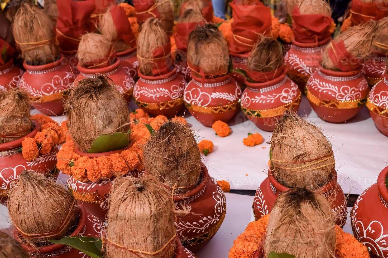 Kalash with coconut and mango leaf with floral decoration earthen pots containing sacred water. Kalash for hindu puja during Jagannath Temple Mangal Kalash Yatra, front view, closeup photo