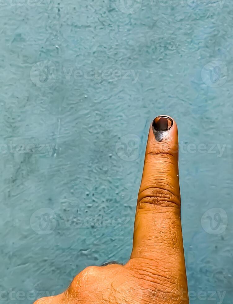 Young voter showing her ink-marked fingers after casting votes near polling booth of east Delhi, India for general Lok Sabha Elections 2024 photo