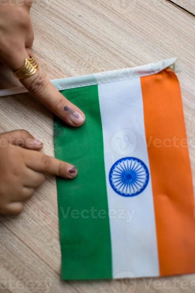 Young voter showing her ink-marked fingers after casting votes near polling booth of east Delhi, India for general Lok Sabha Elections 2024 photo