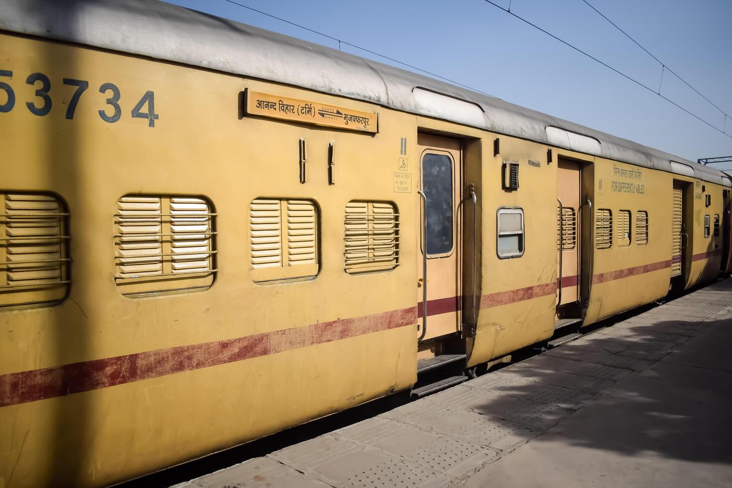 Delhi, India, June 09 2024 - Indian railway express train at departure from Anand Vihar railway station during morning time, Colourful Express train at Delhi railway station photo