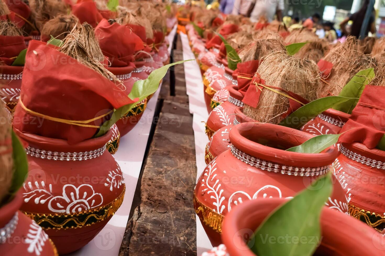 Kalash with coconut and mango leaf with floral decoration earthen pots containing sacred water. Kalash for hindu puja during Jagannath Temple Mangal Kalash Yatra, front view, closeup photo
