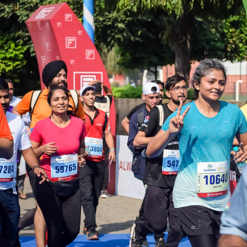 New Delhi, India - July 15 2024 - Vedanta Delhi Half Marathon race after covid in which marathon participants about to cross the finish line, Delhi Half Marathon 2023 photo