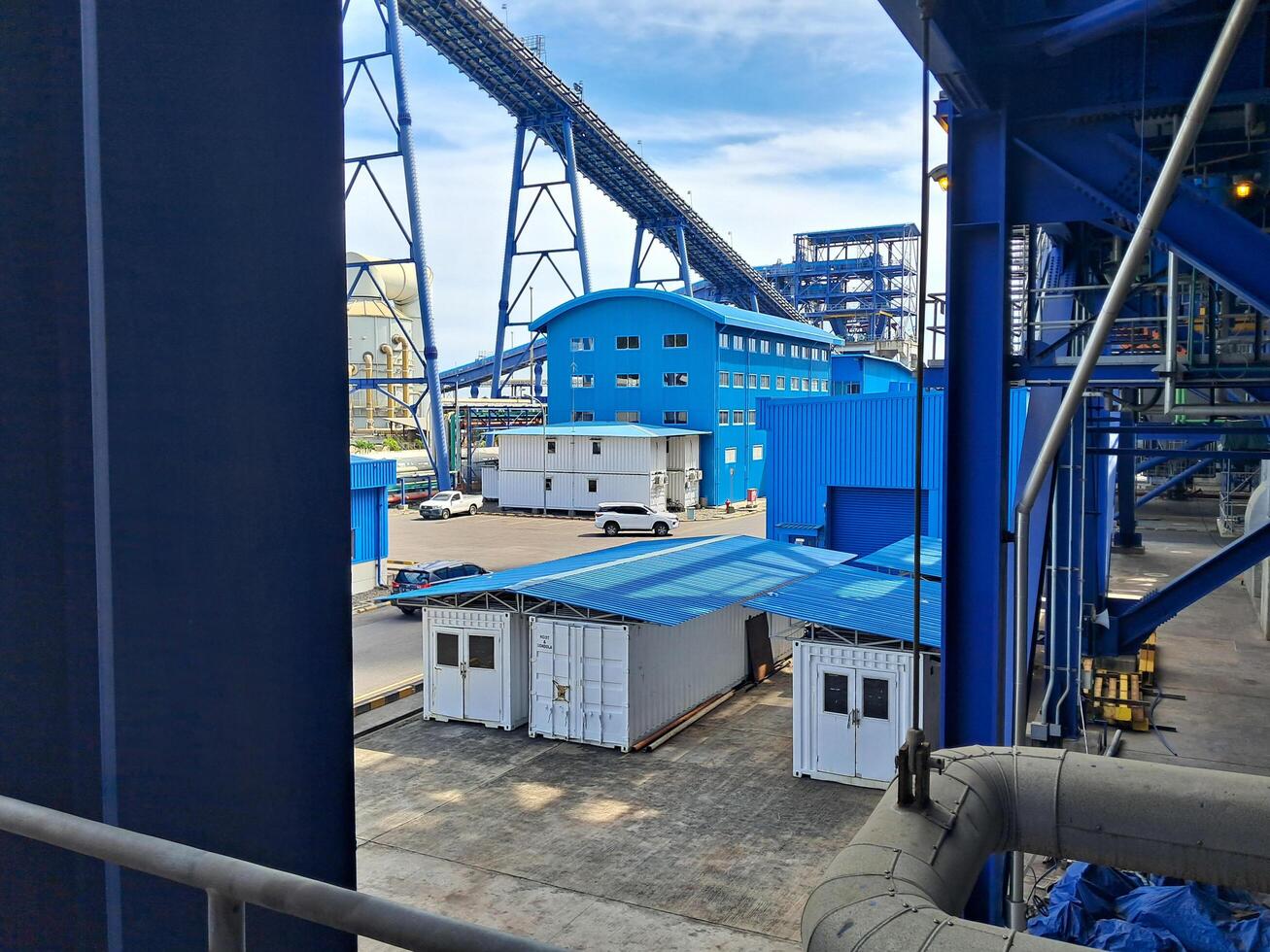 Steam power plant whose building is blue under the blue sky in PLTU Paiton on June 06, 2024 photo