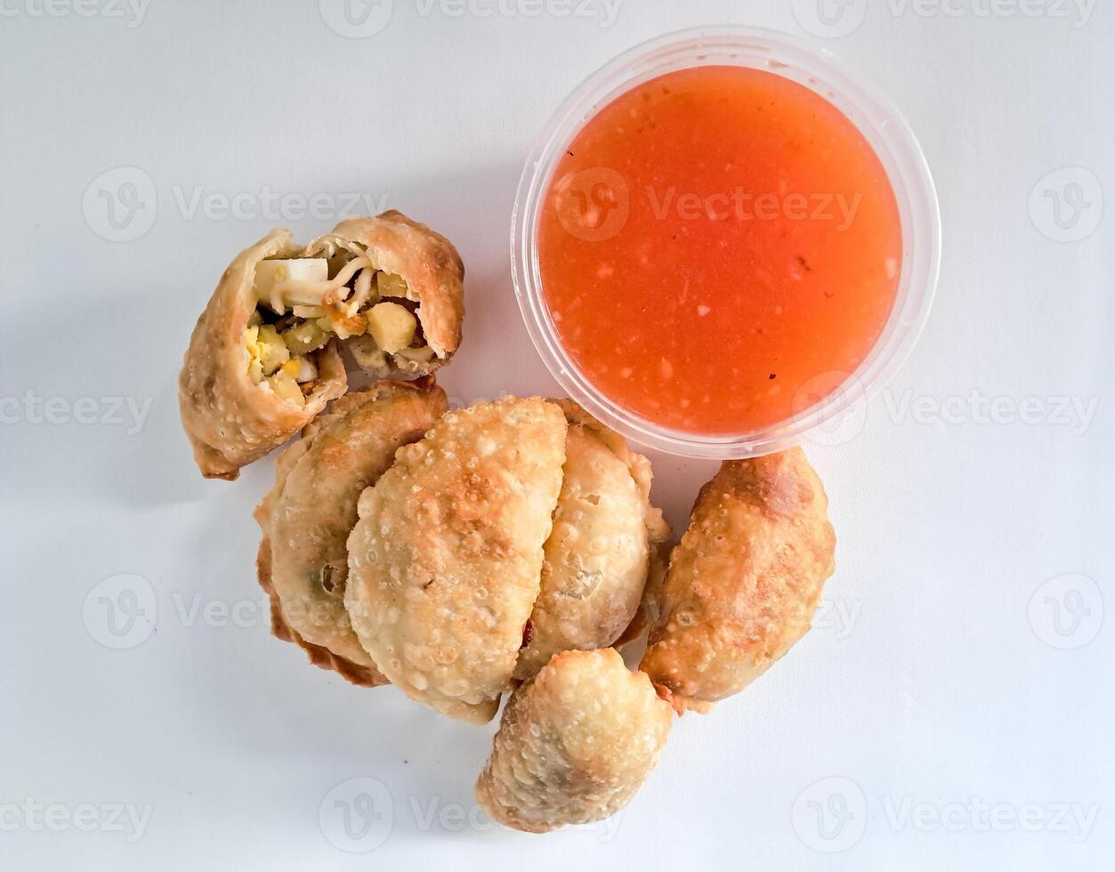 Food called Jalankote, typical of Makassar, South Sulawesi with a white background and delicious chili sauce photo