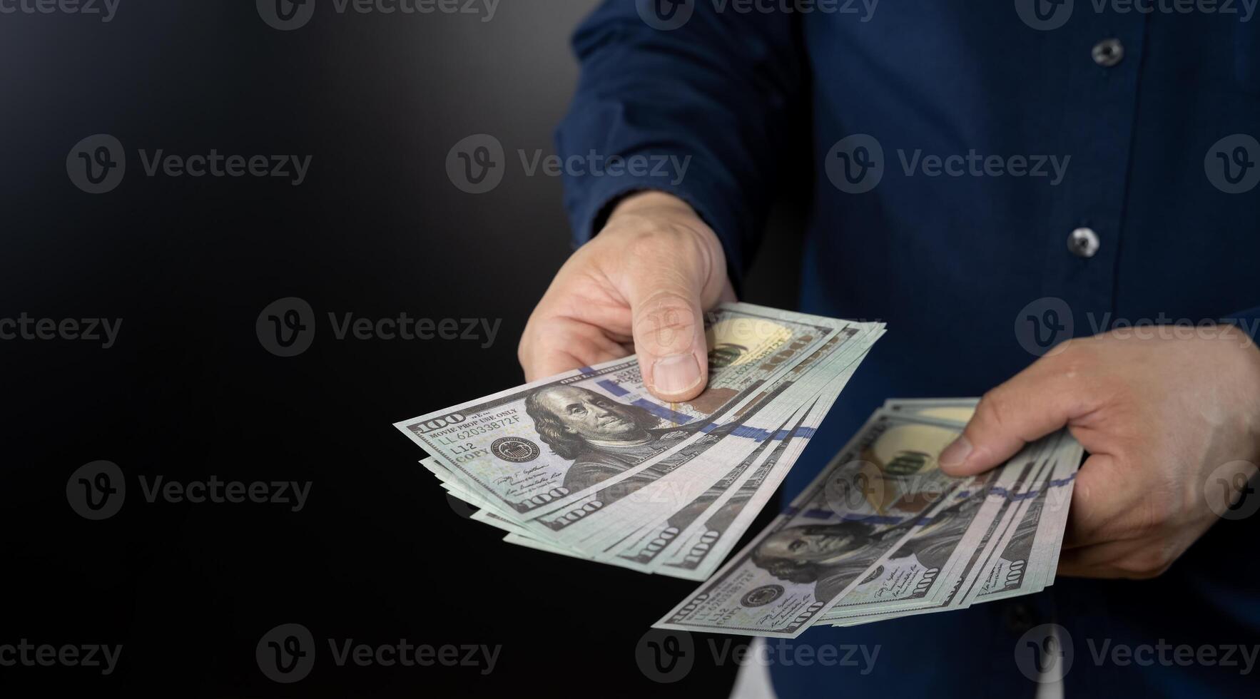 Man's hands holding and counting cash. Man holding dollar banknote.young businessman holding money. photo