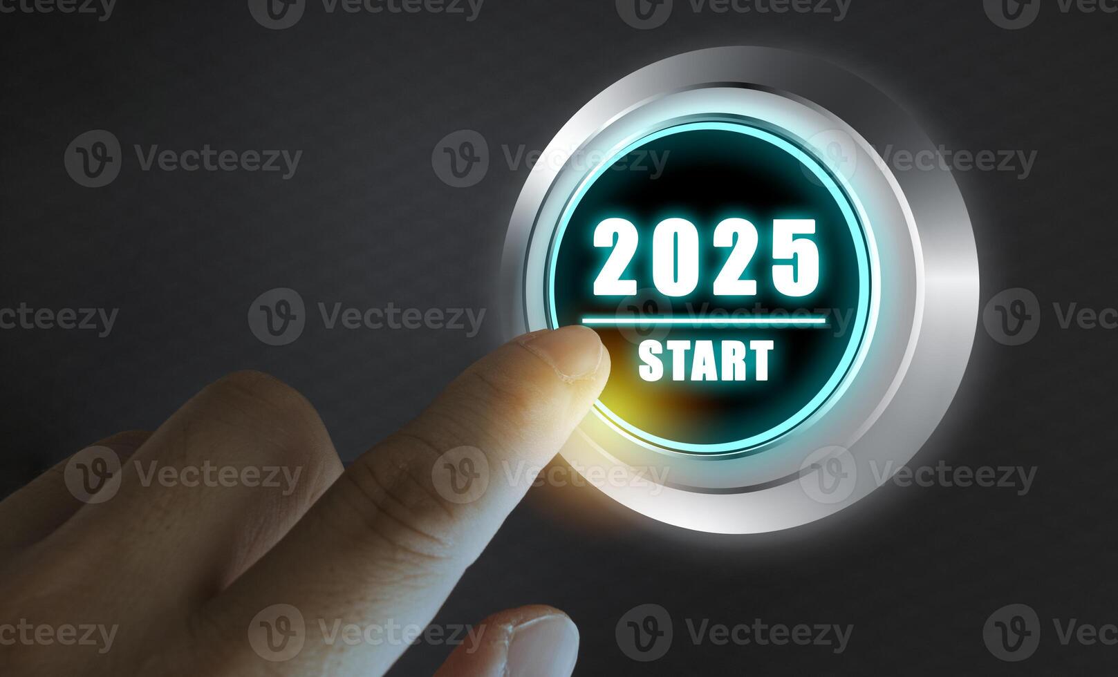 Finger about to press a car ignition button with the text 2025 start. Year two thousand and twenty five concept. photo