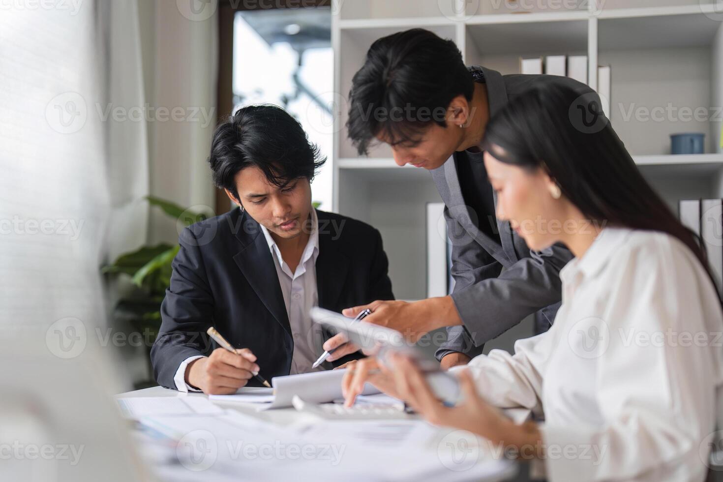 Business Team Collaborating in Modern Conference Room for Strategic Planning and Idea Exchange photo