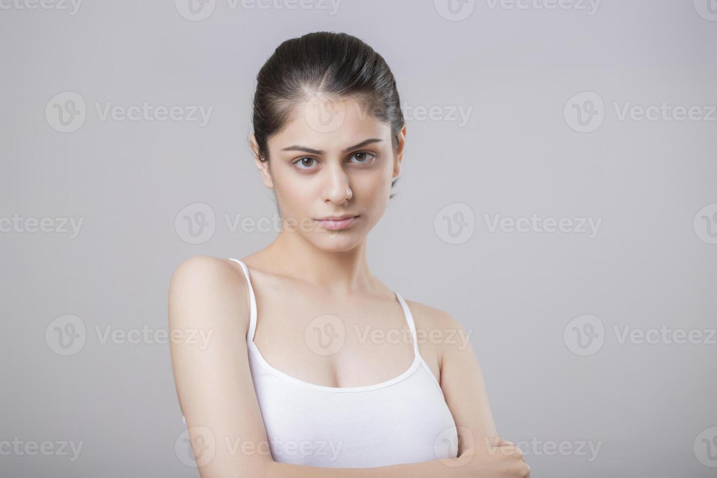 Mature Female Model With Solemn Expression Staring At The Camera photo