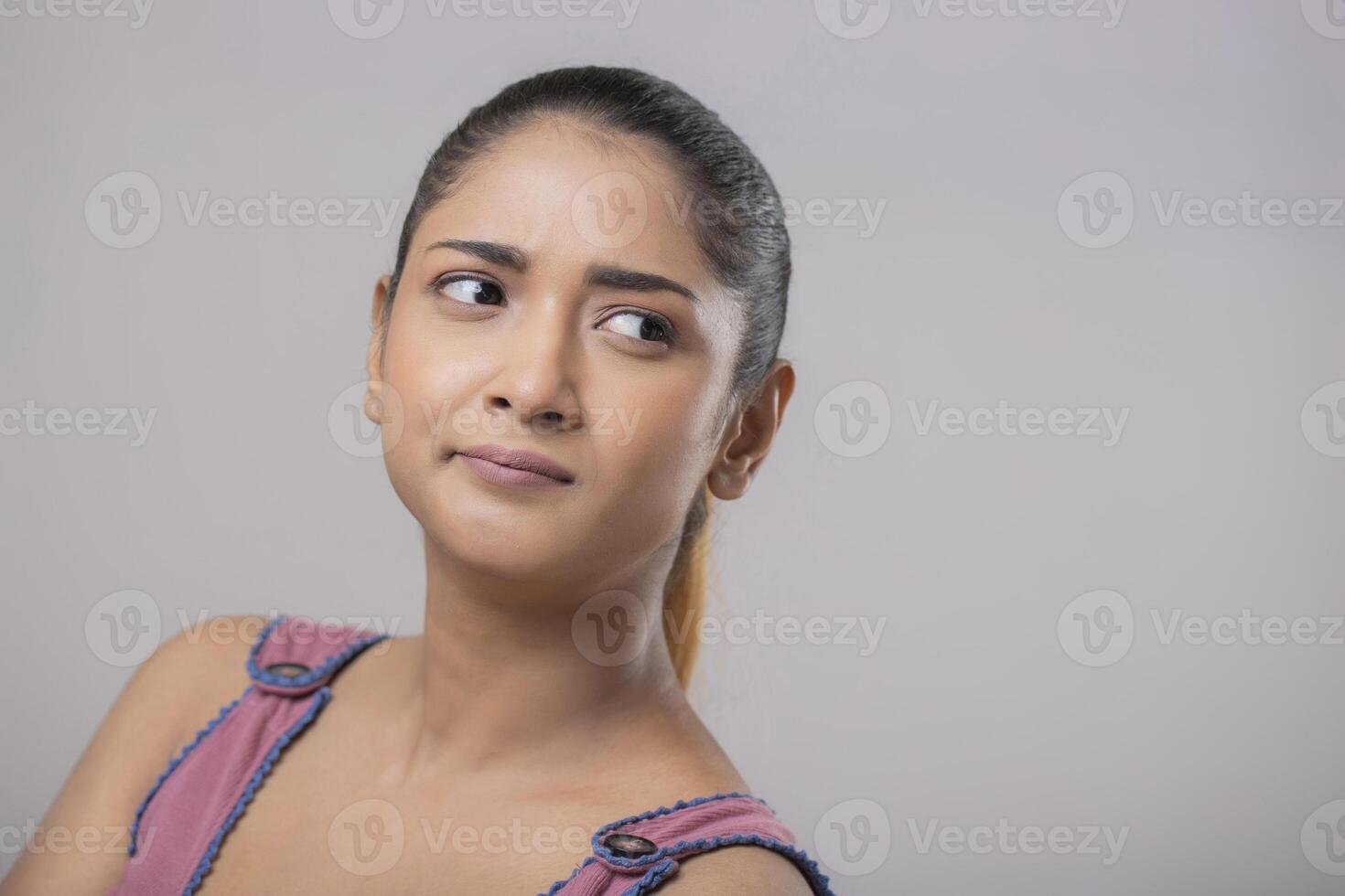 A Beautiful Girl With A Tense Expression On Her Face photo