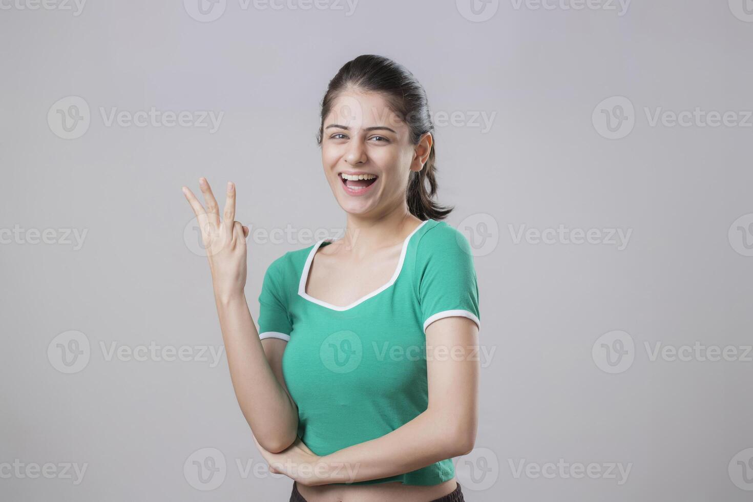 Smart Woman Giving A Three Fingers Sign Gesture With Hands photo