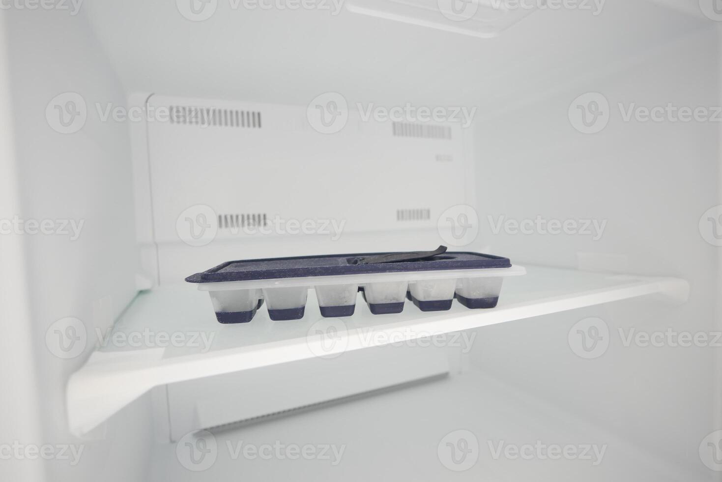 open empty fridge at home photo