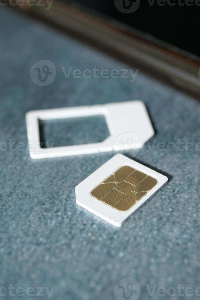 A sim card for a smart phone on table photo