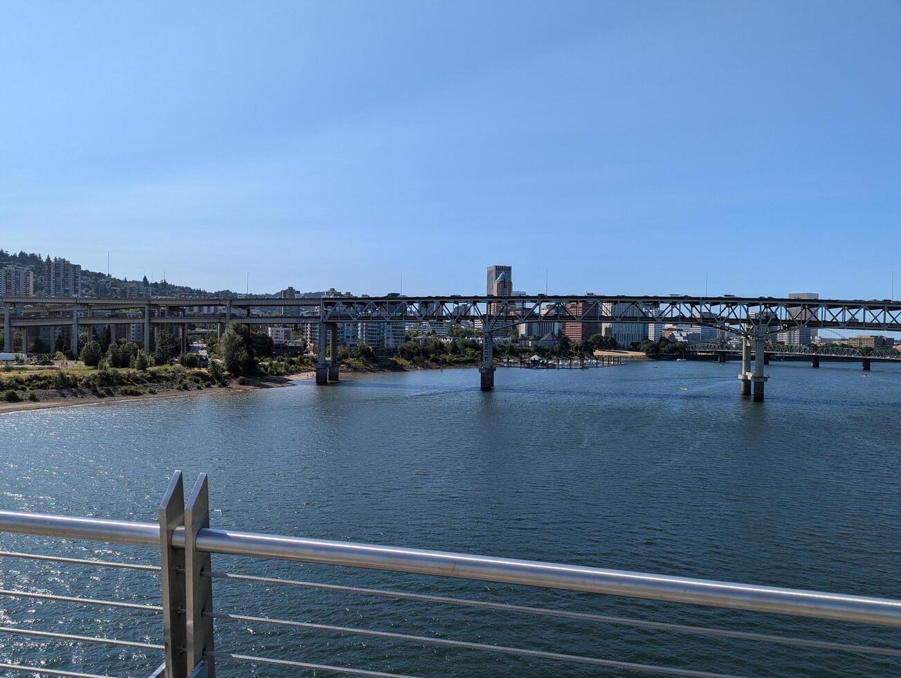 Portland, Oregon, USA - 07.11.2024 View from the Ross Island Bridge to the Marquam Bridge and the city photo