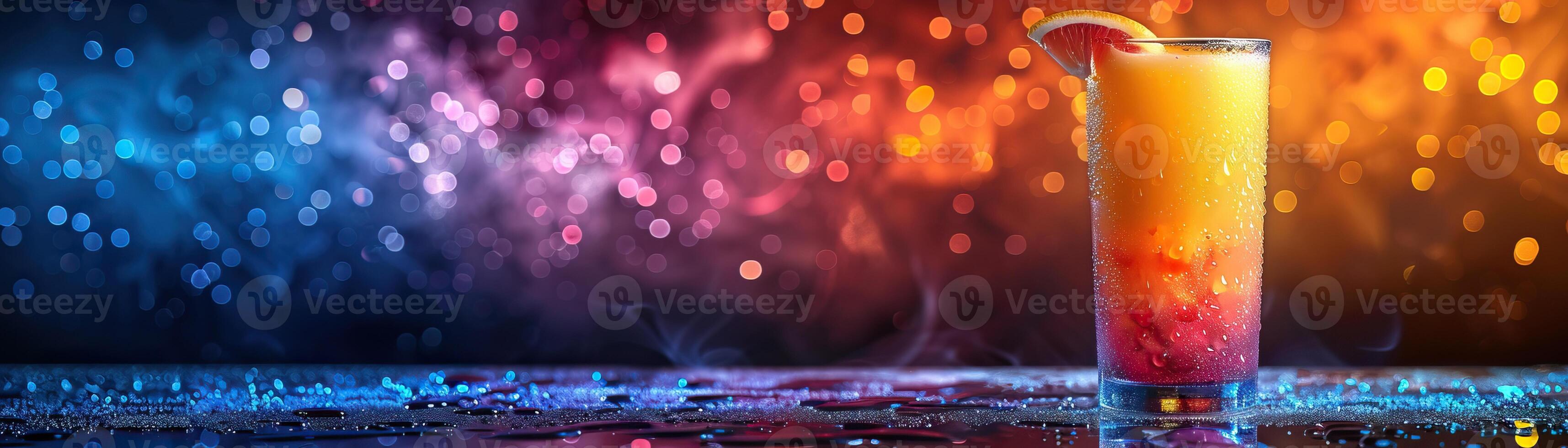 A delicious and refreshing cocktail with a beautiful gradient from yellow to orange to red. Perfect for a summer day or a tropical vacation. photo