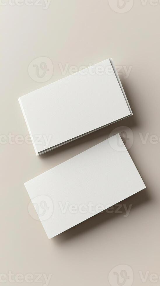 2 blank business cards mockup, view from top, light beige background, atmospheric ambiance photo