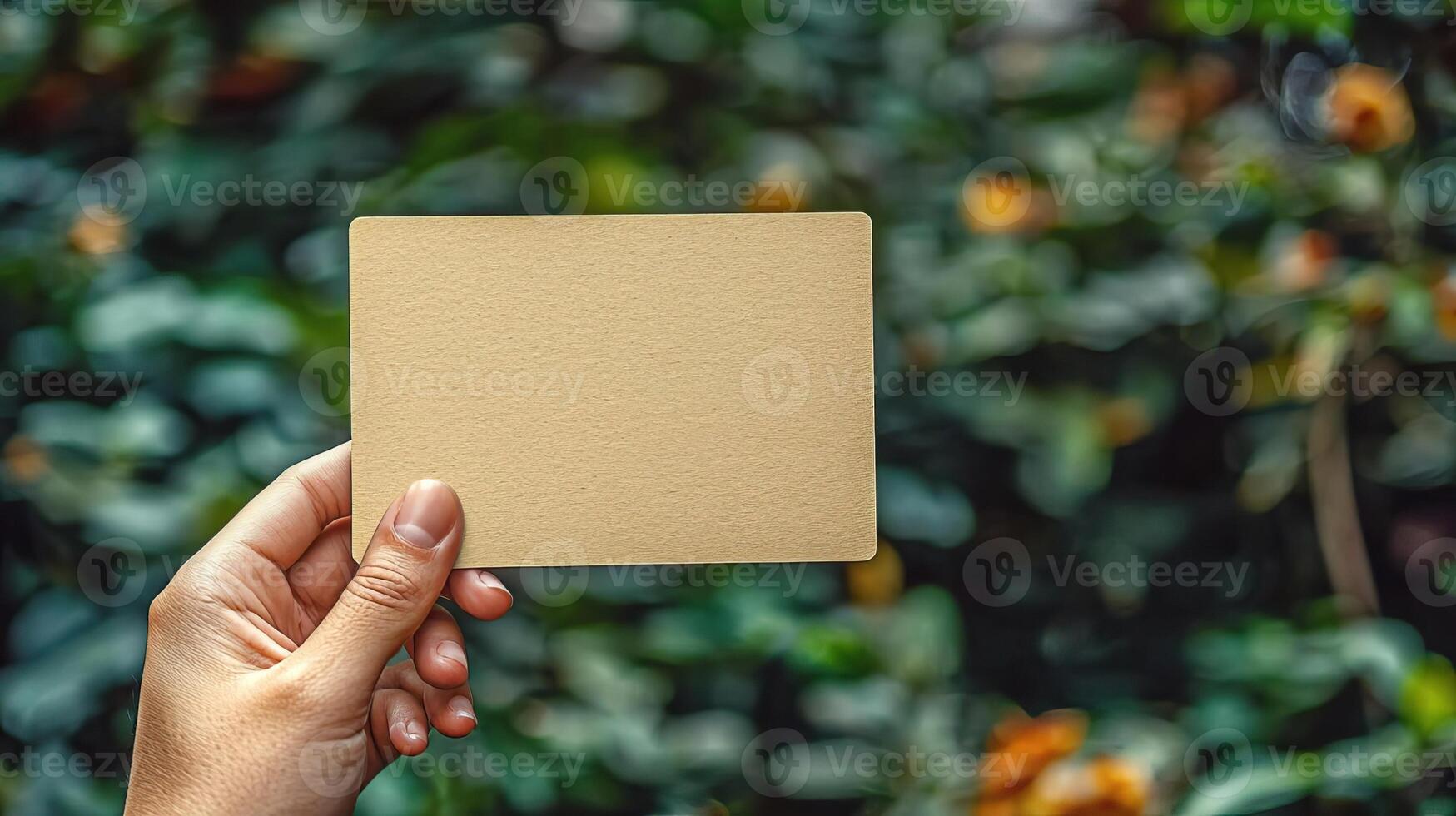 a photo of hand holding a postcard the postcards orientation is vertical and blank