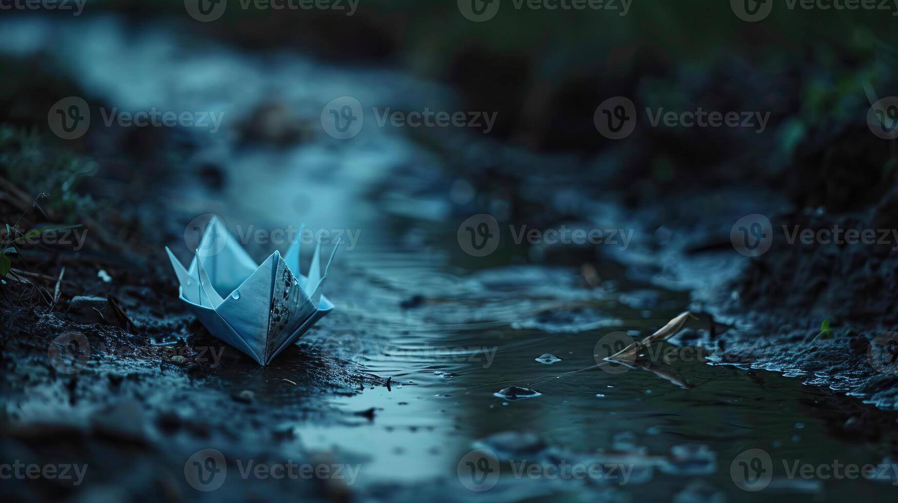 beautiful and unique origami boat floating on a small stream of water photo