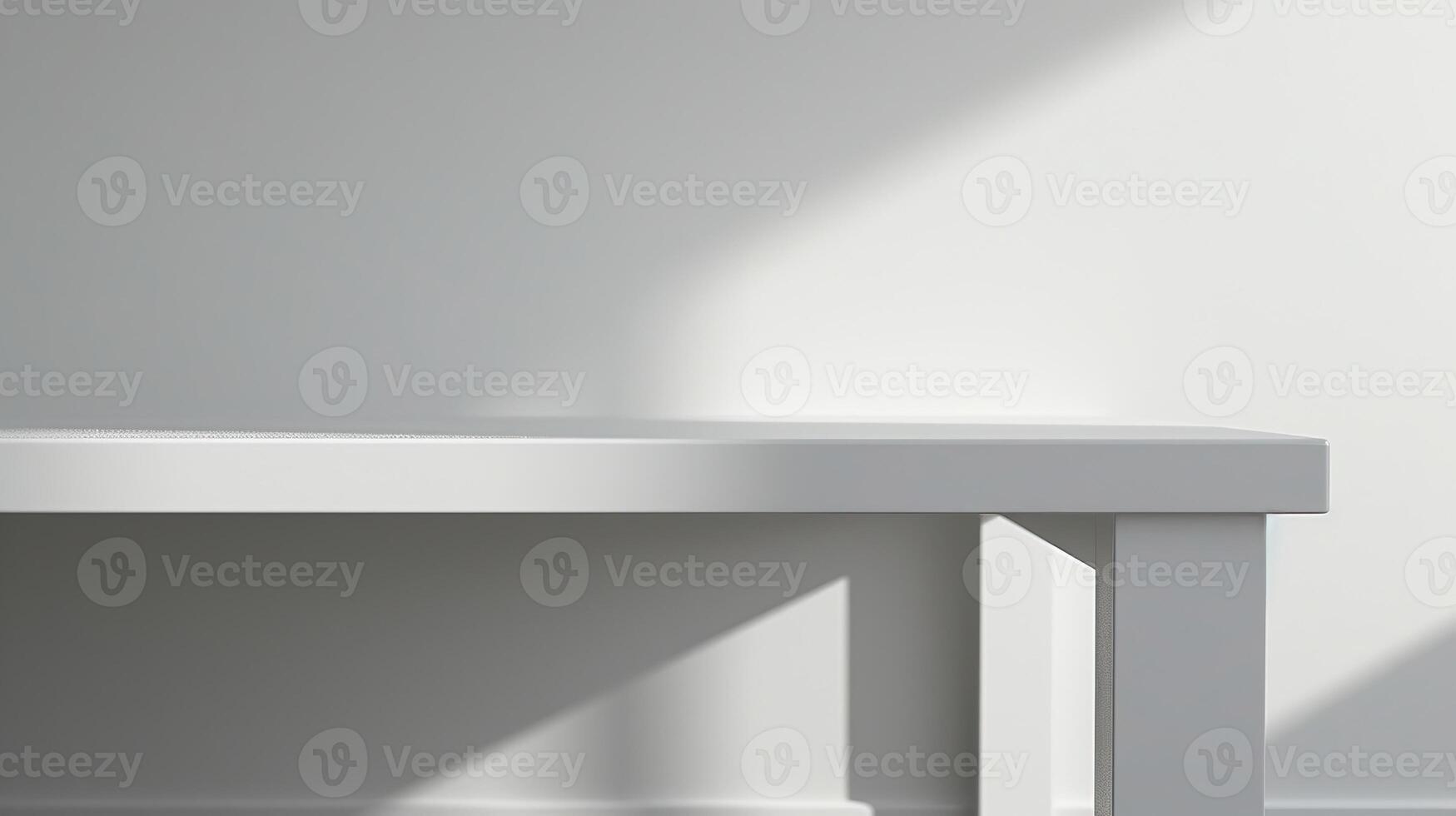 White table in front of white wall with soft lighting photo