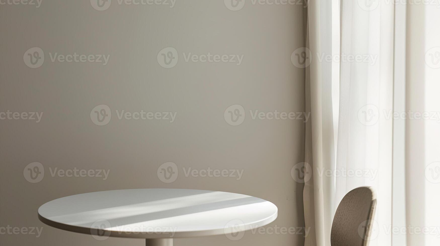 Minimalist interior with a round white table and sunlight streaming through curtains, creating a serene and modern aesthetic. photo
