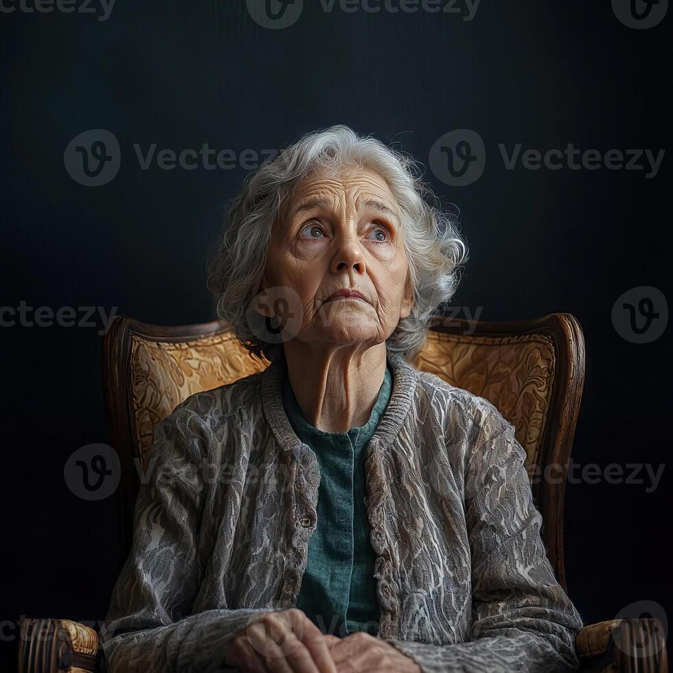 Sad elderly woman sitting in a chair, surrounded by empty space, looking away with a melancholic expression, alone and reflective photo