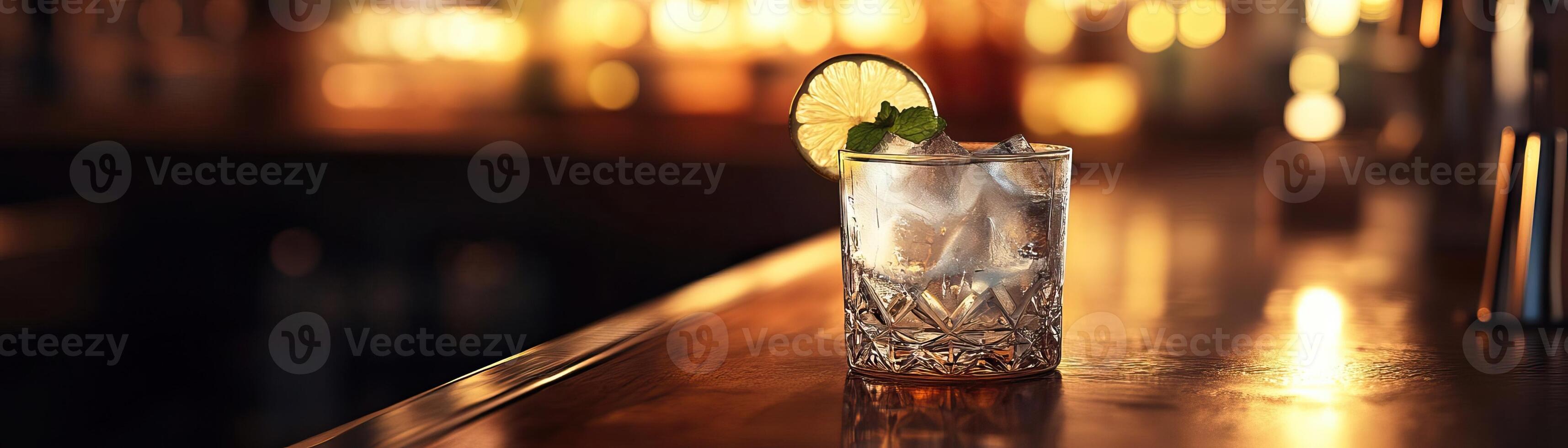 1 An elegant, dimly lit shot of a gin tonic on a cozy bar table, the warm ambient light inviting, panoramic negative space above for minimalist text photo