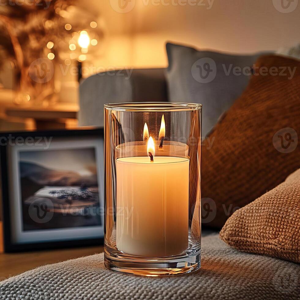 Blank clear straight candle glass amidst a setting with a plush pillow, a scented diffuser, and delicate string lights, modern warm bedroom mockup, serene and stylish photo