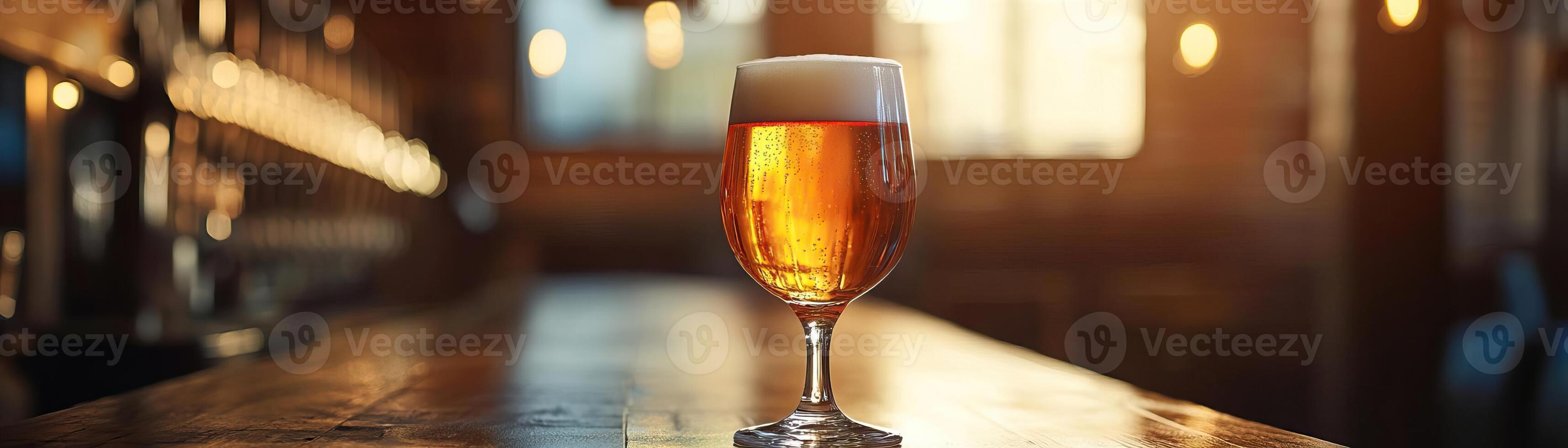 1 An elegant, dimly lit shot of a craft beer glass on a cozy pub table, the warm ambient light inviting, panoramic negative space above for minimalist text photo