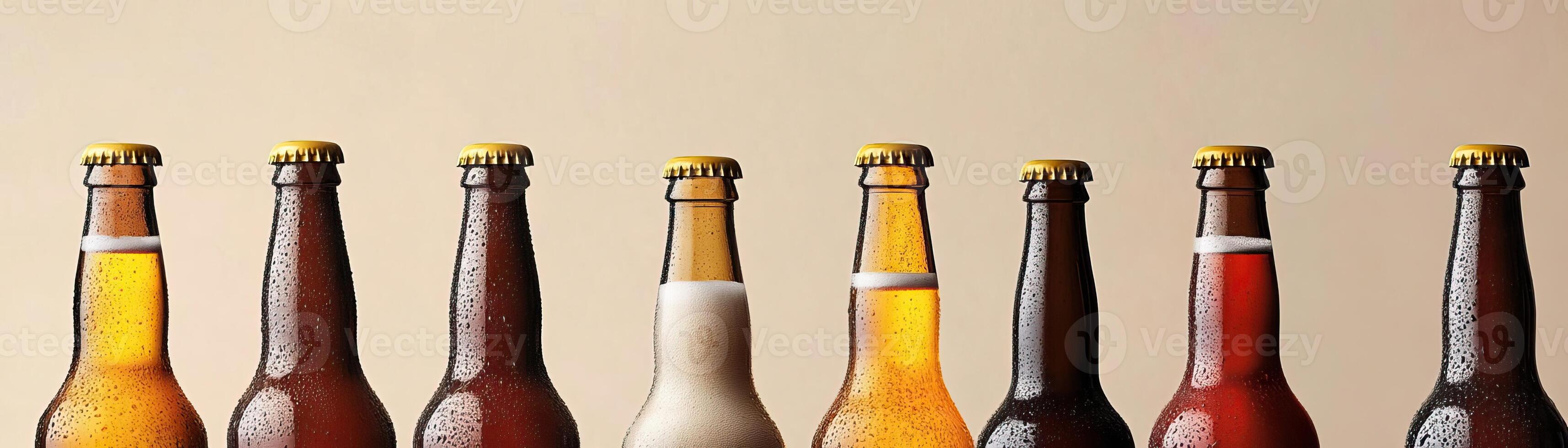 1 An artistic arrangement of several craft beer bottles, varying heights and colors, set against a uniform, lightcolored background, broad negative space for text photo