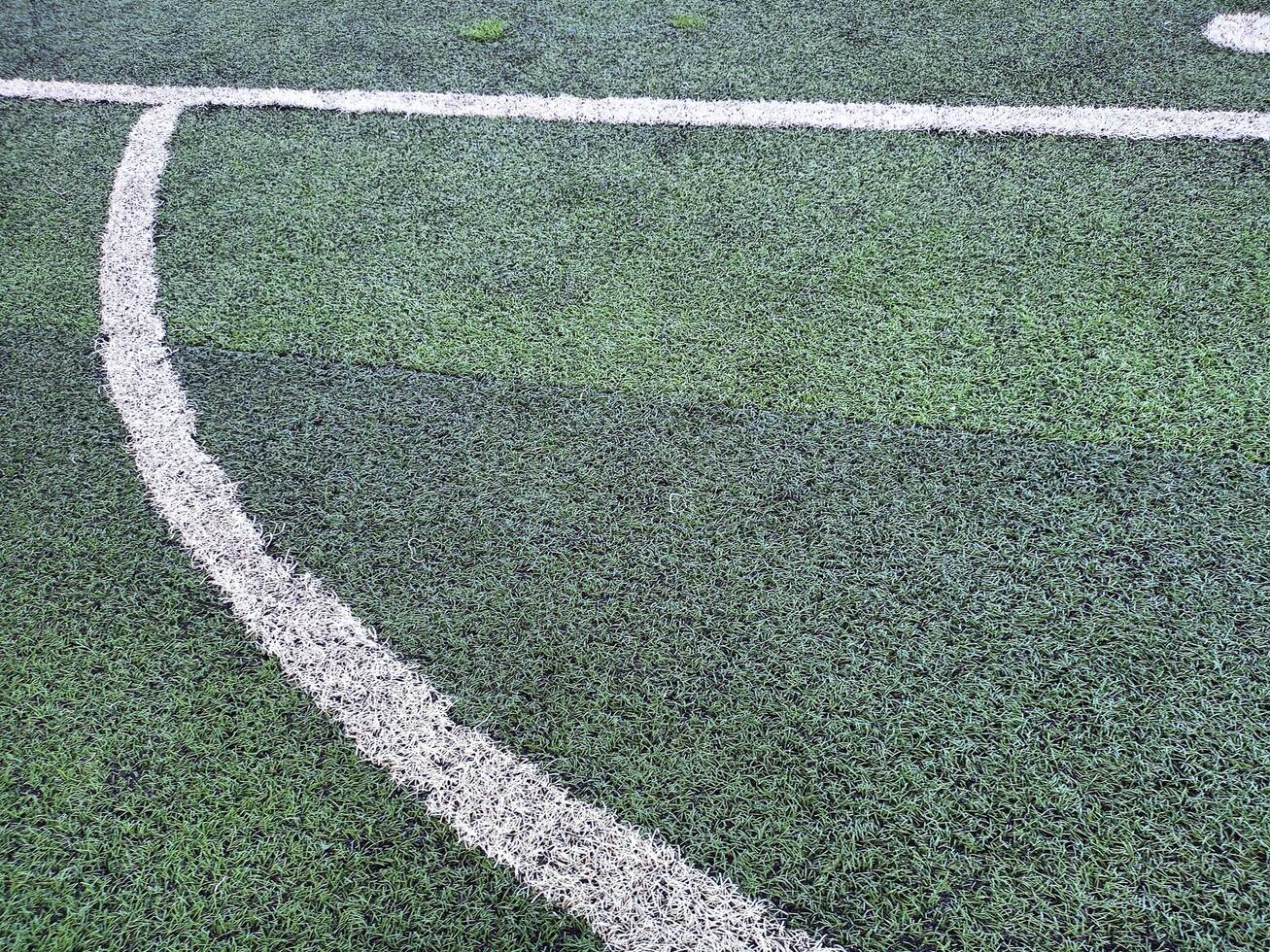Turf and penalty kick positions on football fields photo