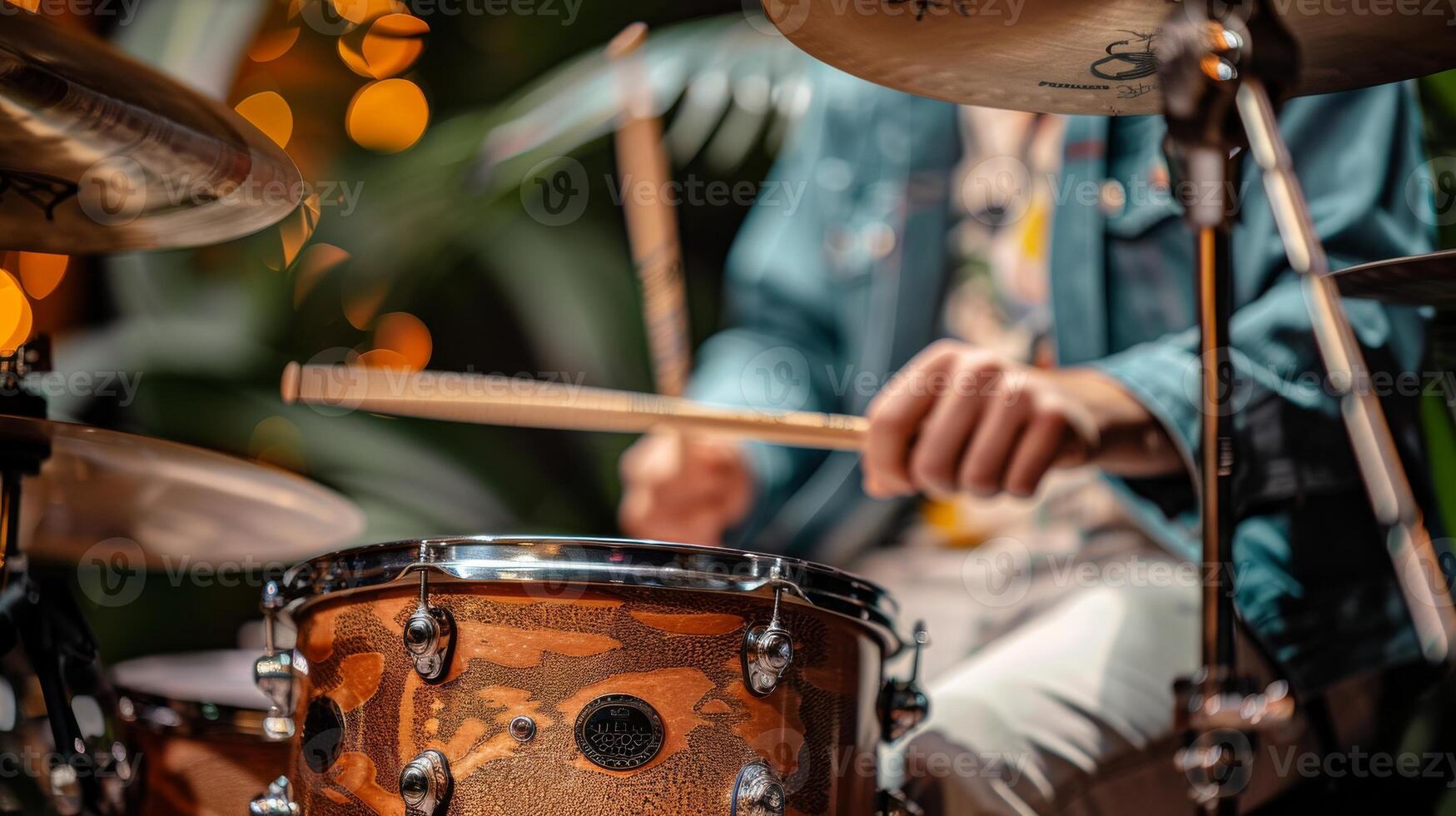 Drumsticks strike snare drum as percussion elements. Energetic atmosphere during a jazz performance photo