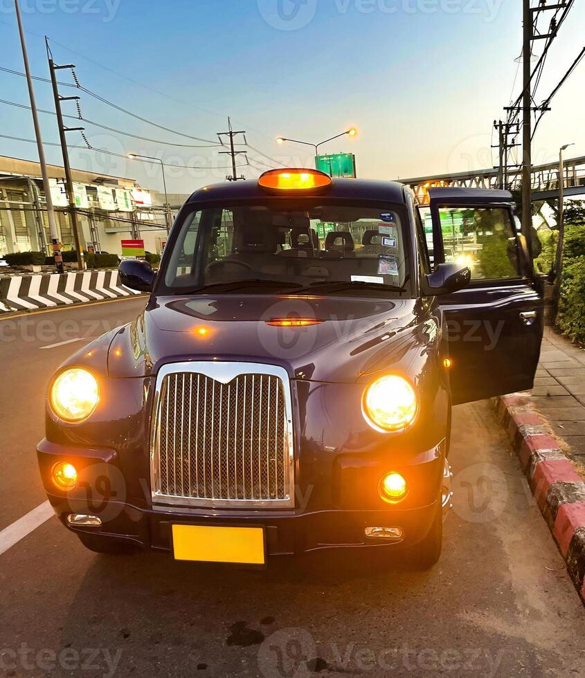 Classic Taxi at Dusk on Phuket Street photo