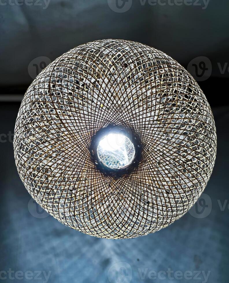 Intricate Woven Lamp with Illuminating Center photo