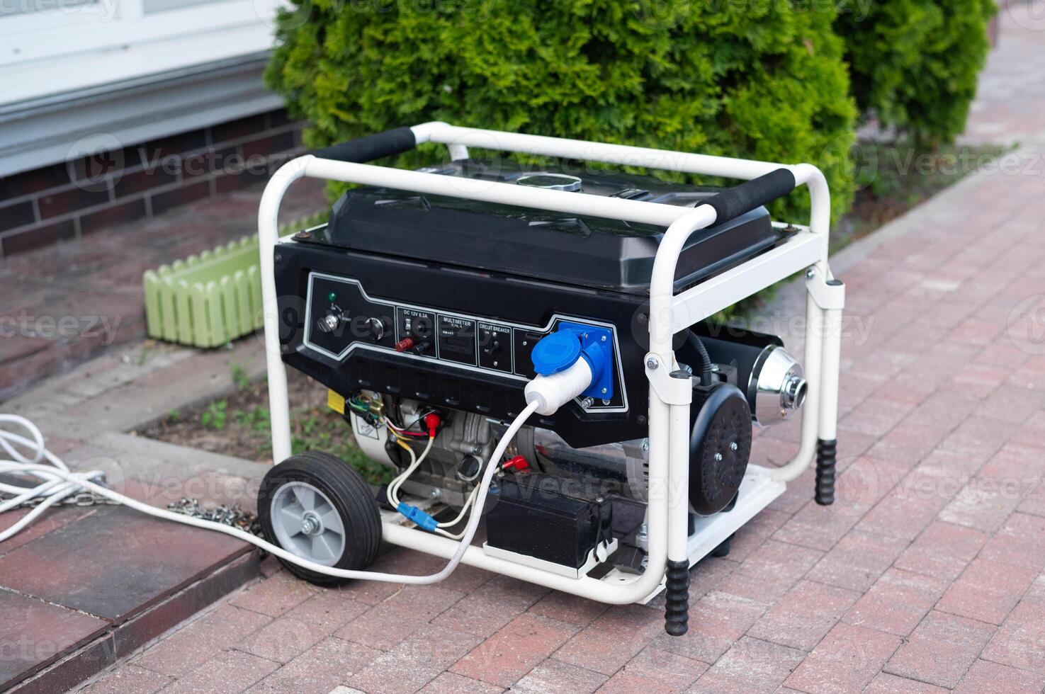 Power supply generator placed on street sidewalk. outdoor diesel power generator in Ukraine. photo