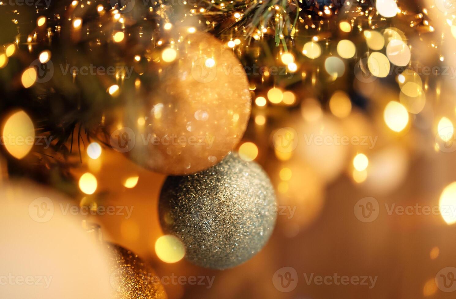Close-up of gold and silver balls on the Christmas tree. New year card or background. photo