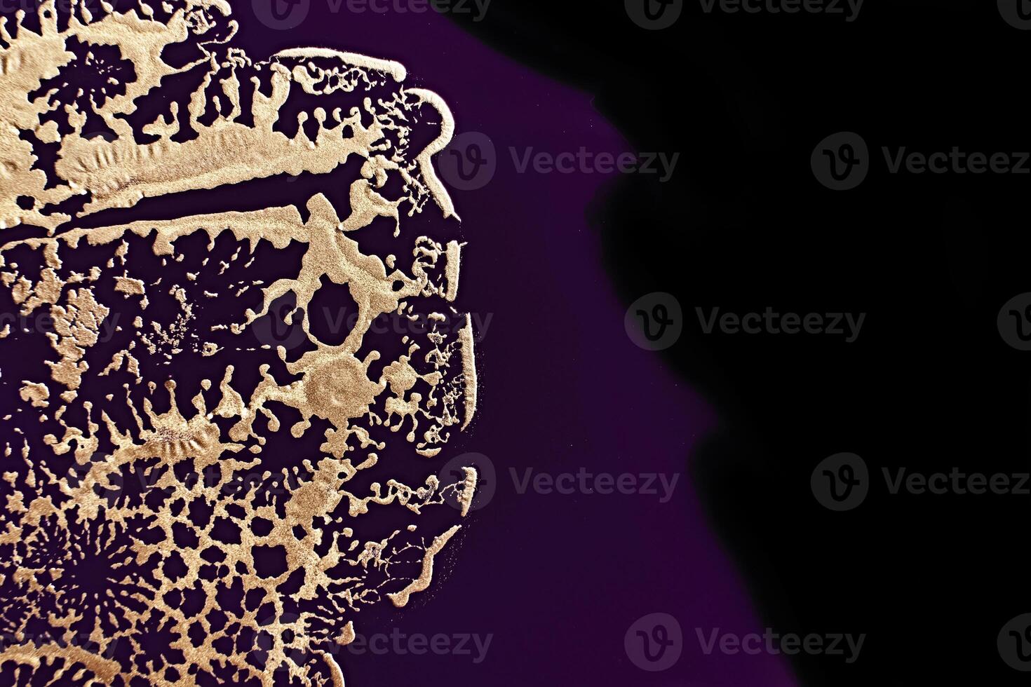 Fluid Art. Metallic gold abstraction on purple waves. Marble effect background or texture photo