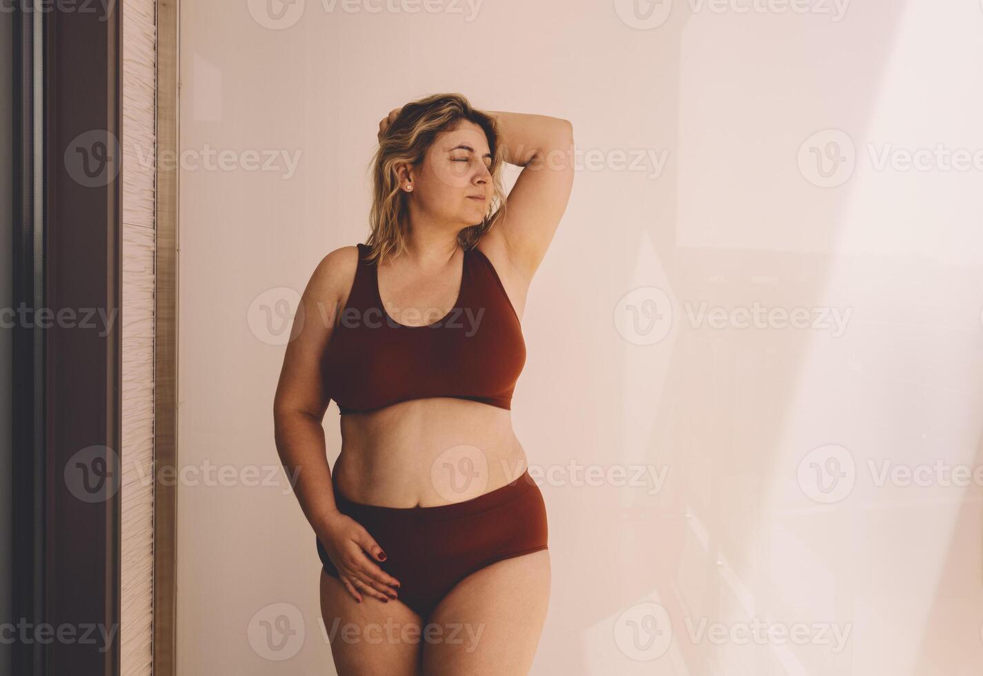 Confident young woman feeling positive and comfortable in her body. photo