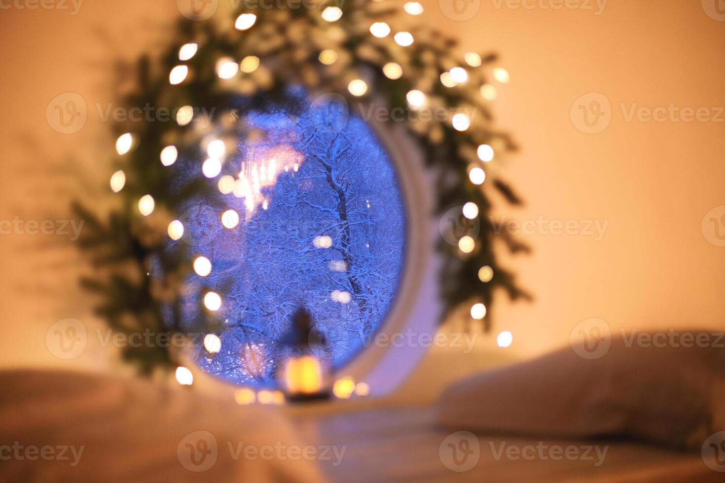 a window with a christmas tree and lights photo