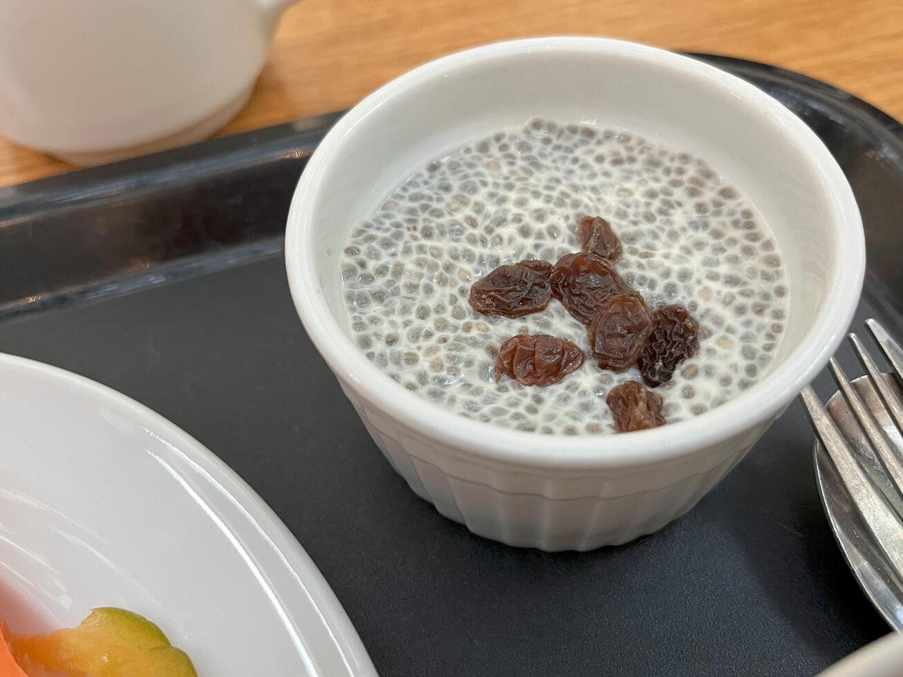 Chia seed pudding with raisins. Healthy breakfast food concept photo
