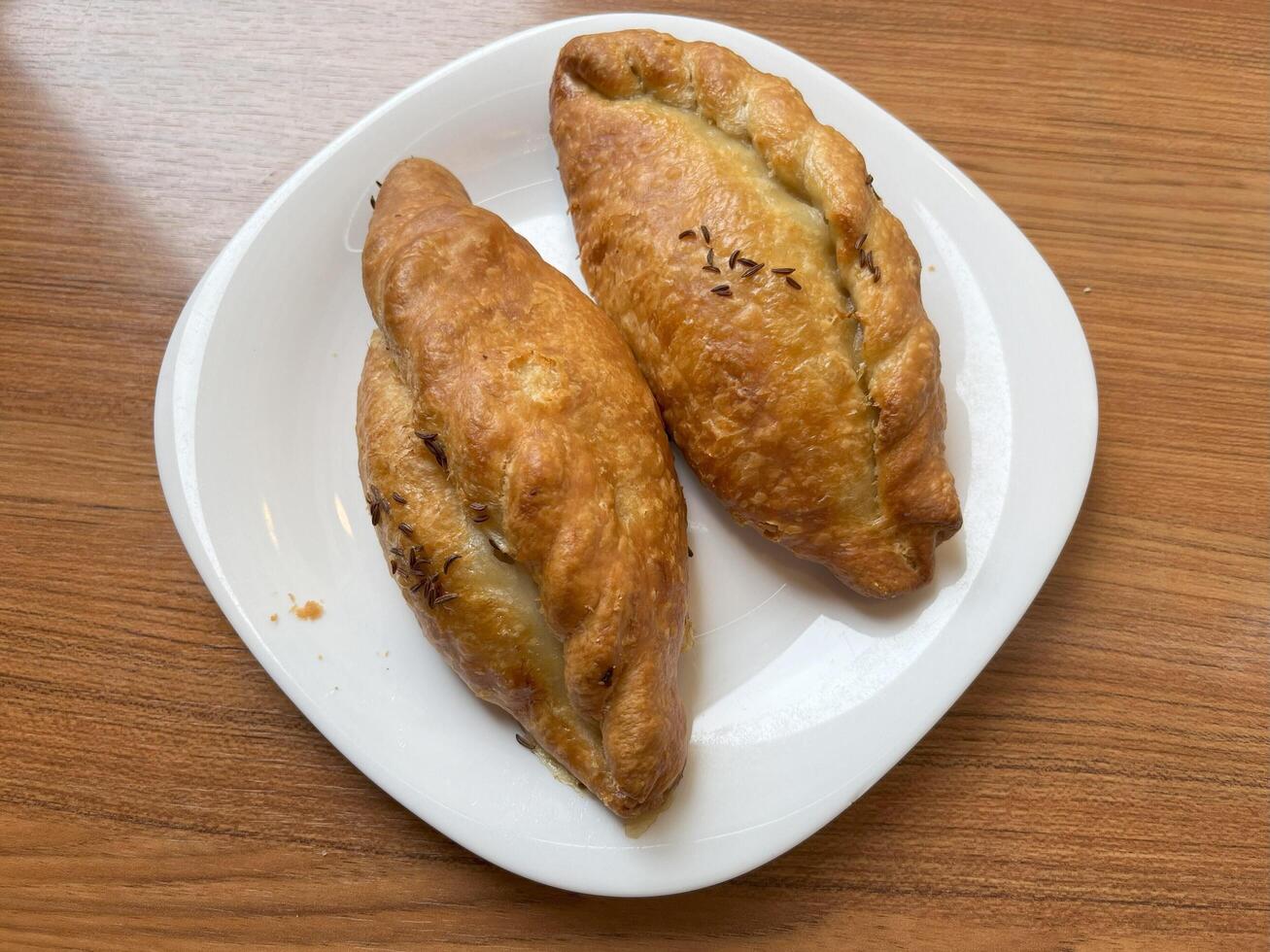 Kibinai, traditional Lithuanian food, pastries filled with various meat, onion and pepper, popular with Karaite ethnic minority in Vilnius, Lithuania, street food market photo