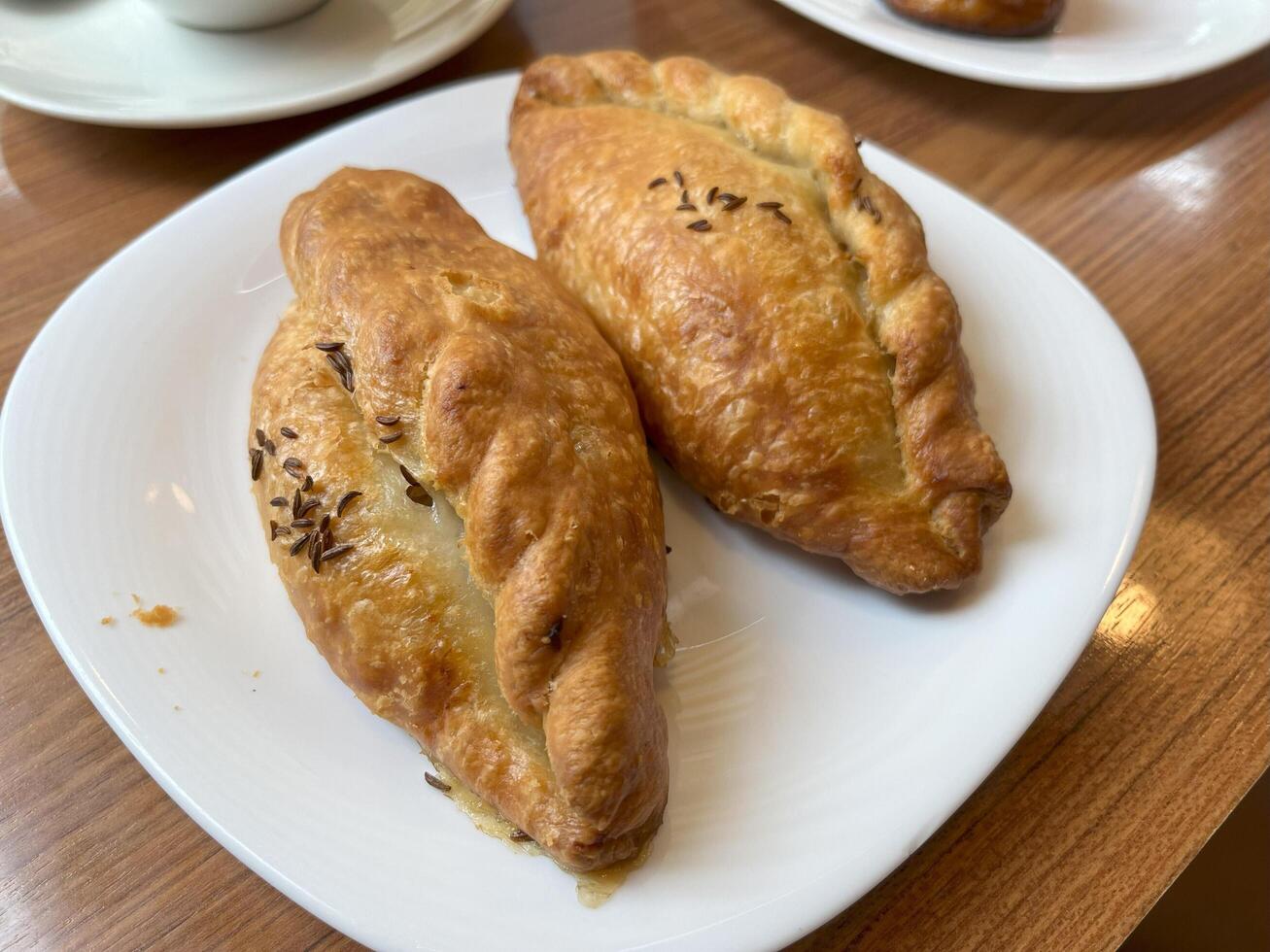 Kibinai, traditional Lithuanian food, pastries filled with various meat, onion and pepper, popular with Karaite ethnic minority in Vilnius, Lithuania, street food market photo