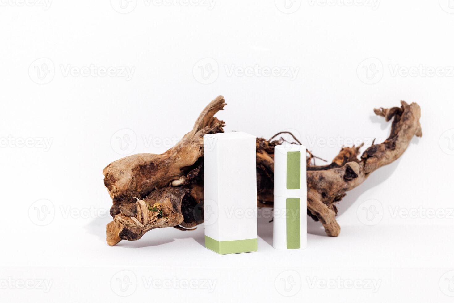 Mock up of cylindrical bottle for cream and plastic jar with green collagen eye patches photo