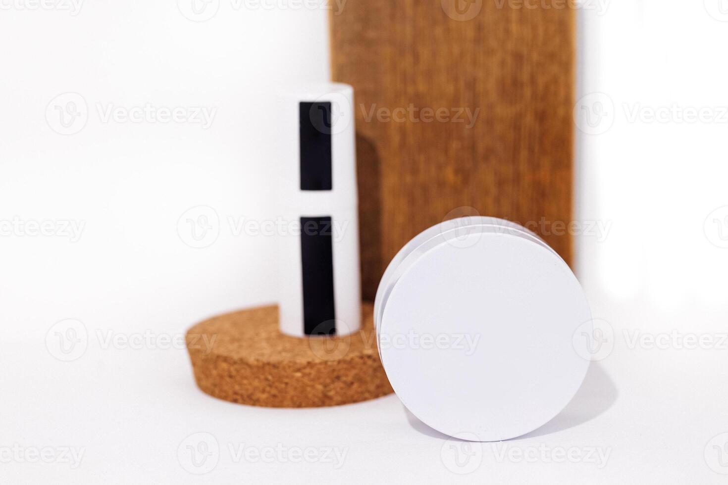 Mockup of round box for beauty product on cork stage and aloe plant photo