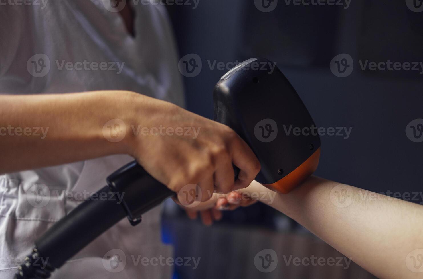 Young woman receiving photo epilation while visiting beauty center on salon