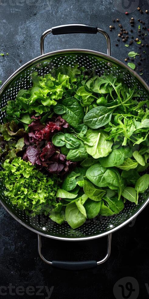 Freshly washed green and red leaf lettuce in colander photo