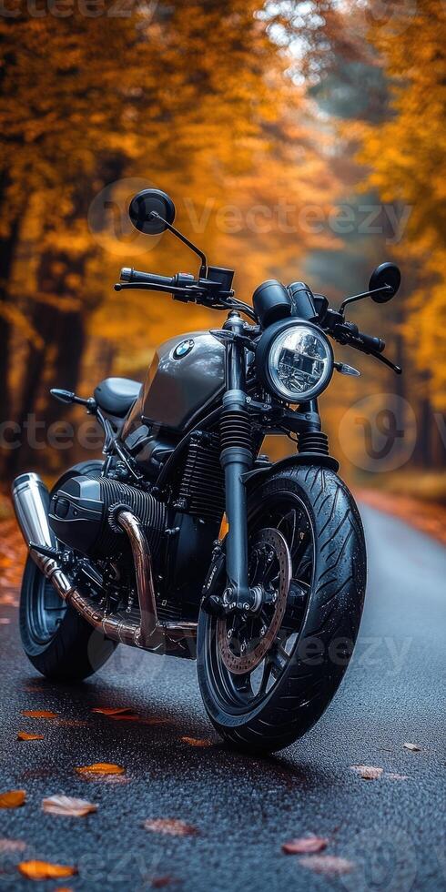 A stunning motorcycle parked on a rural road at sunset, highlighting its metallic parts against a dramatic sky, symbolizing freedom and adventure in a modern, artistic style. photo