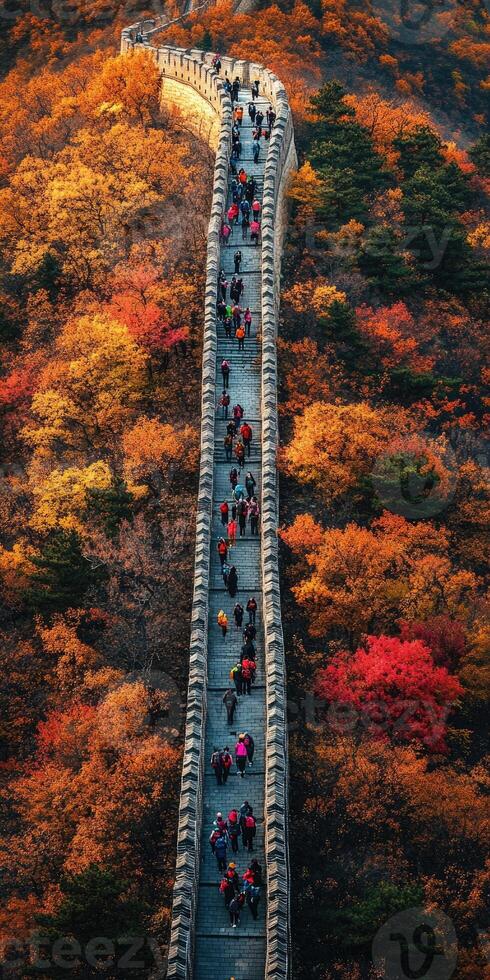 Great Wall of China with autumn foliage and tourists. photo