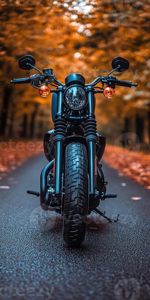 A stunning motorcycle parked on a rural road at sunset, highlighting its metallic parts against a dramatic sky, symbolizing freedom and adventure in a modern, artistic style. photo