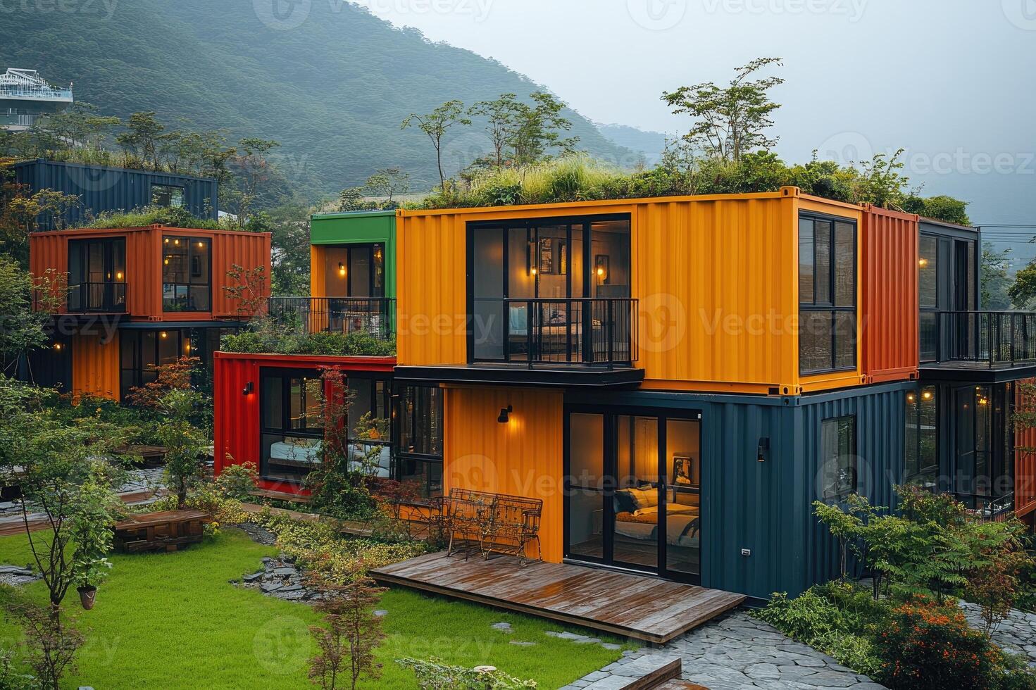 Modern container house with large windows overlooking tropical garden photo
