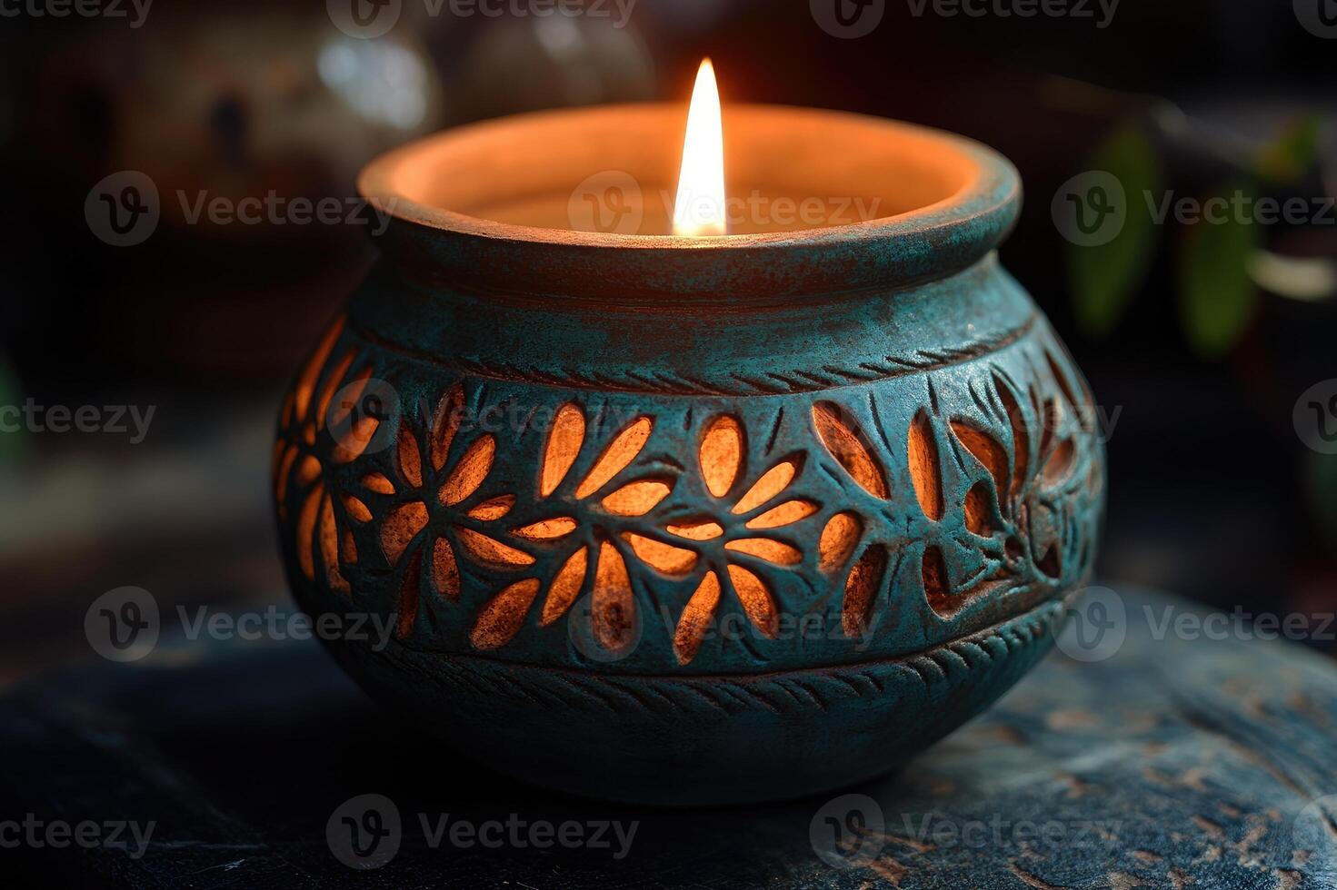 Burning candle creating a romantic atmosphere on a wooden table photo